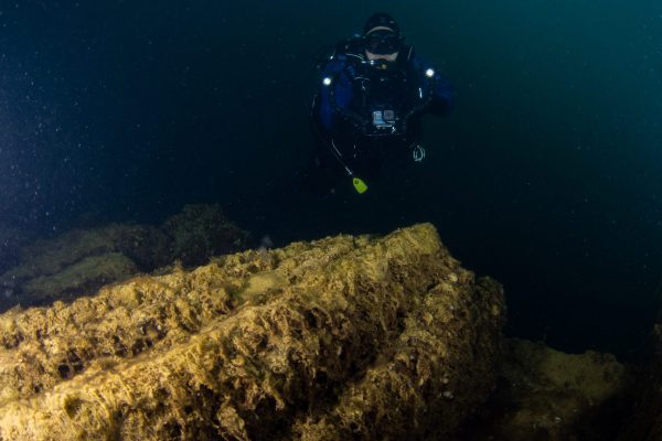 Divers from Scuba 2000 explore the Grisham historical shipwreck located at Stoney Cove, England